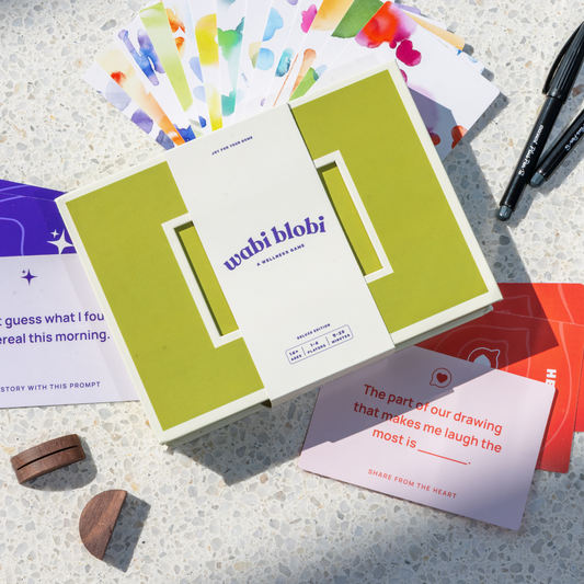 Wabi Blobi Deluxe Edition box open with watercolor blob postcards, prompt cards and art pens
