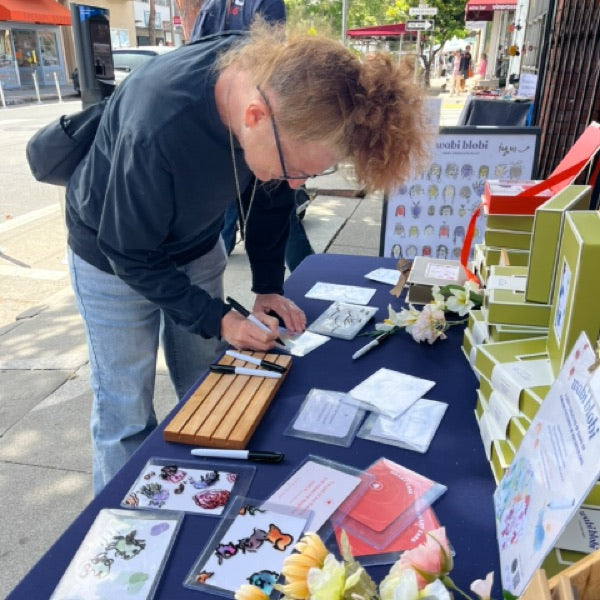 Wabi Blobi player with their doodled card
